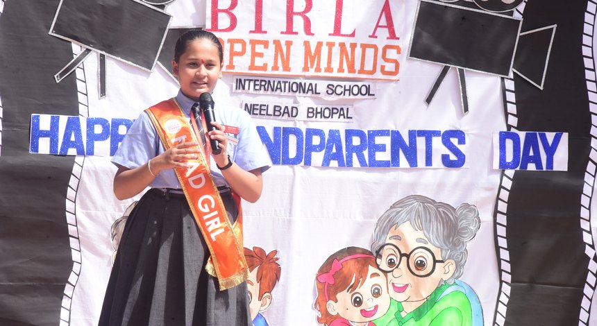 A grandmother honoured on stage at Birla Open Minds International School, Bhopal