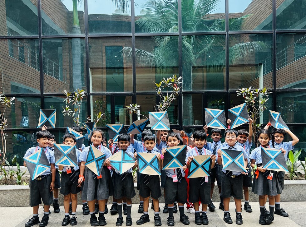 Shields held up on the steps at Birla Open Minds International School, Bhopal