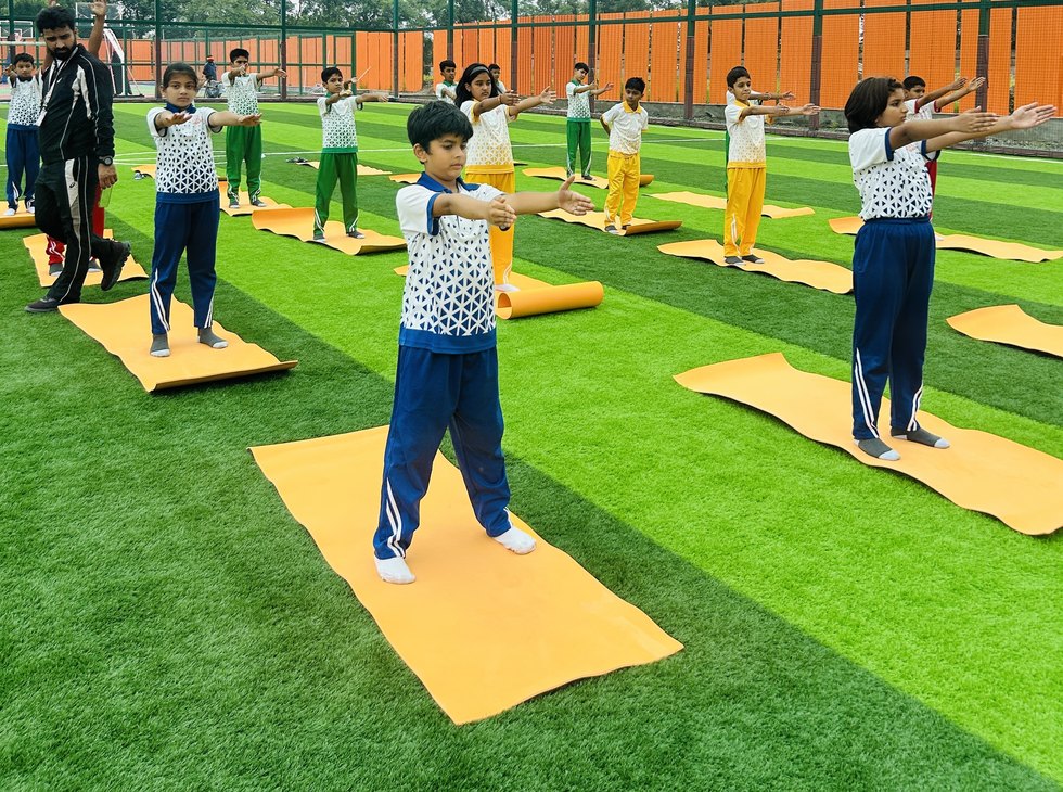 Yoga on the turf, one mat each at Birla Open Minds International School, Bhopal