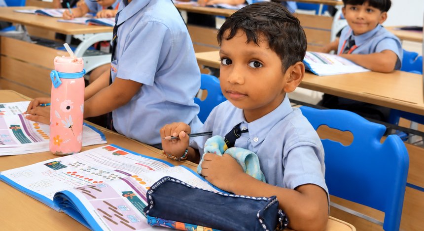 Two to a desk, and the work in front of both at Birla Open Minds International School, Bhopal